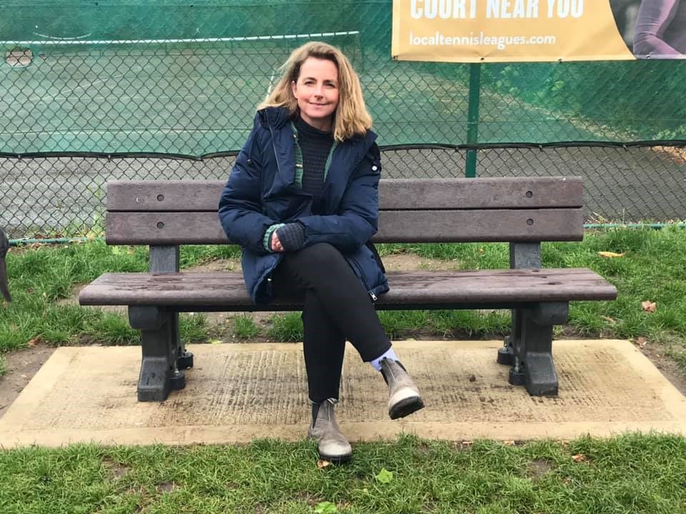 Councillor Lucy sat on a bench