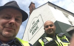Ben and local police officer outside the Gordon Arms