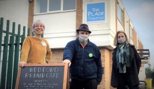 Councillors Lucy and Ben with blackboard with Bedford Repair Cafe written on it