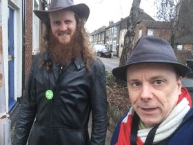 Photo of councillor Ben Foley in the foreground, helped byl James Long